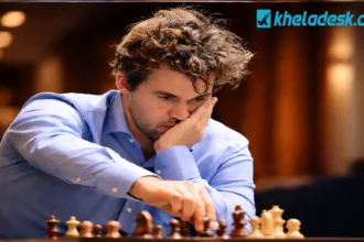 ম্যাগনাস কার্লসেন গভীর মনোযোগে দাবার বোর্ডে চাল দিচ্ছেন, একজন বিশ্বখ্যাত দাবা গ্র্যান্ডমাস্টার।